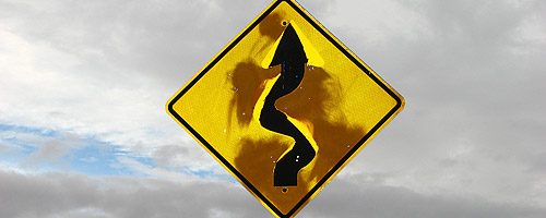 Battered sign on road frequently used for SUV commercial shoots, Valley of Fire